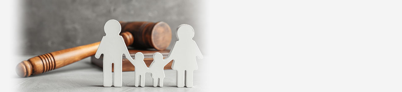 Family figure and gavel on table